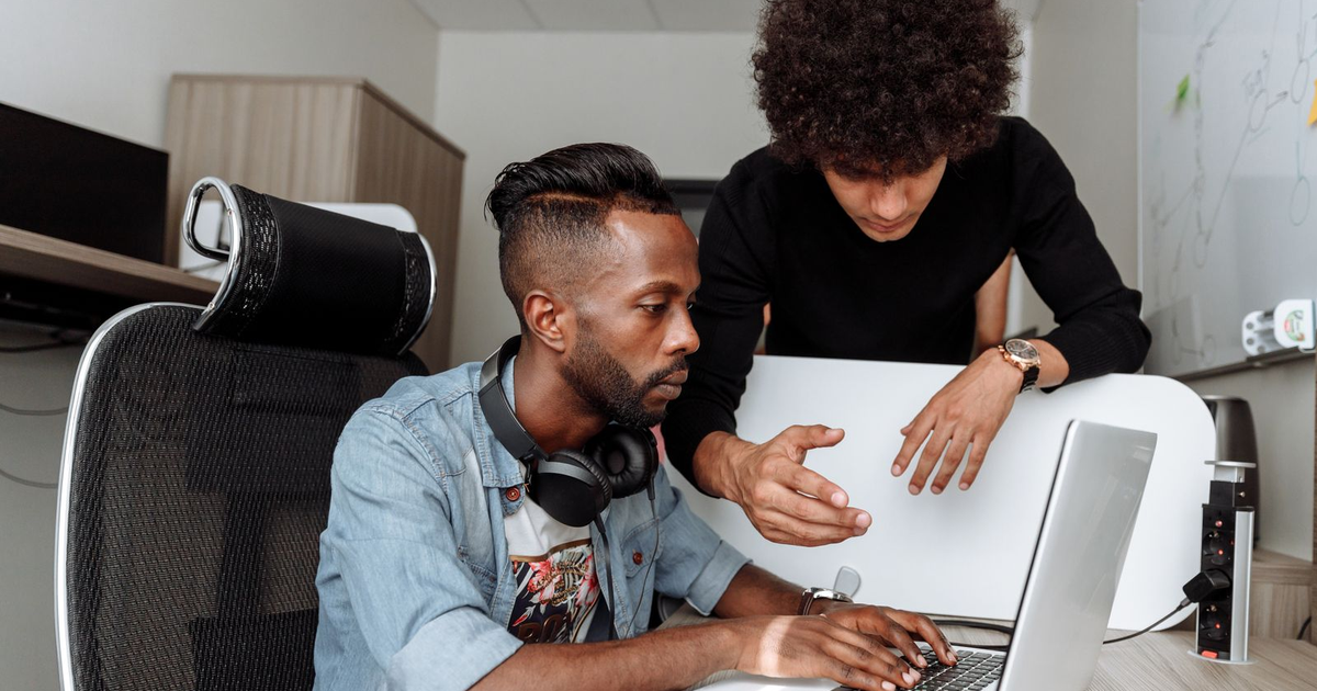 team choosing the best CMS for business website with a developer