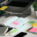 owner filling in a digital marketing audit checklist for a small business